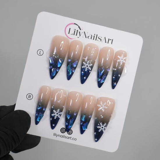 Handmade Winter Snowflake Press-On Nails – blue glitter, snowflake details, and crystal accents. Perfect for holidays, birthdays, vacations, or as a festive gift for her