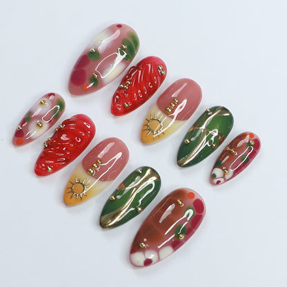 Handmade Press-On Nails with vibrant red, green, and gold designs, featuring intricate details and glossy finishes. Perfect for holidays, birthdays, vacations, or as a unique gift for her.