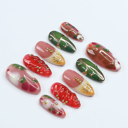 Handmade Press-On Nails with vibrant red, green, and gold designs, featuring intricate details and glossy finishes. Perfect for holidays, birthdays, vacations, or as a unique gift for her.