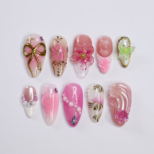 Handmade Pink Floral Press-On Nails – Spring Collection soft pink tones with 3D flowers, pearls, gold accents, and a waterproof-tested finish. Perfect for birthdays, holidays, vacations, or as a thoughtful gift for her. 