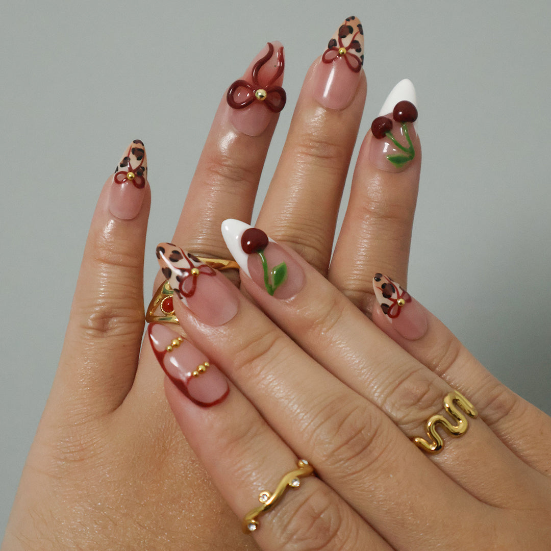 Sweet cherry Handmade Press-On Nails – playful and bold design with cherry motifs, leopard print accents, and 3D bows. Perfect for holidays, vacations, birthdays, valentine or as a stylish gift for her