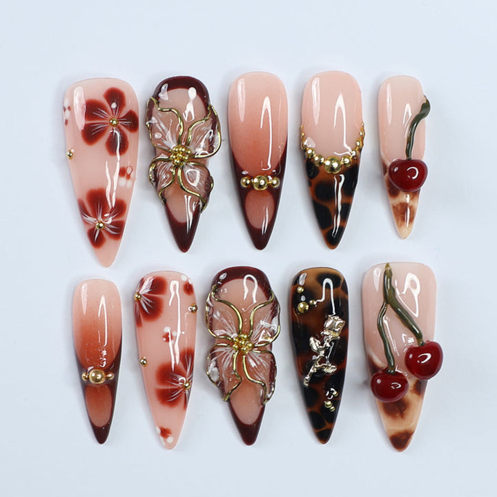 Handmade Press-On Nails with deep cherry tones, 3D floral accents, gold details, and glossy finishes. Perfect for holidays, birthdays, or as a luxurious gift for her