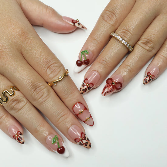 Sweet cherry Handmade Press-On Nails – playful and bold design with cherry motifs, leopard print accents, and 3D bows. Perfect for holidays, vacations, birthdays, valentine or as a stylish gift for her