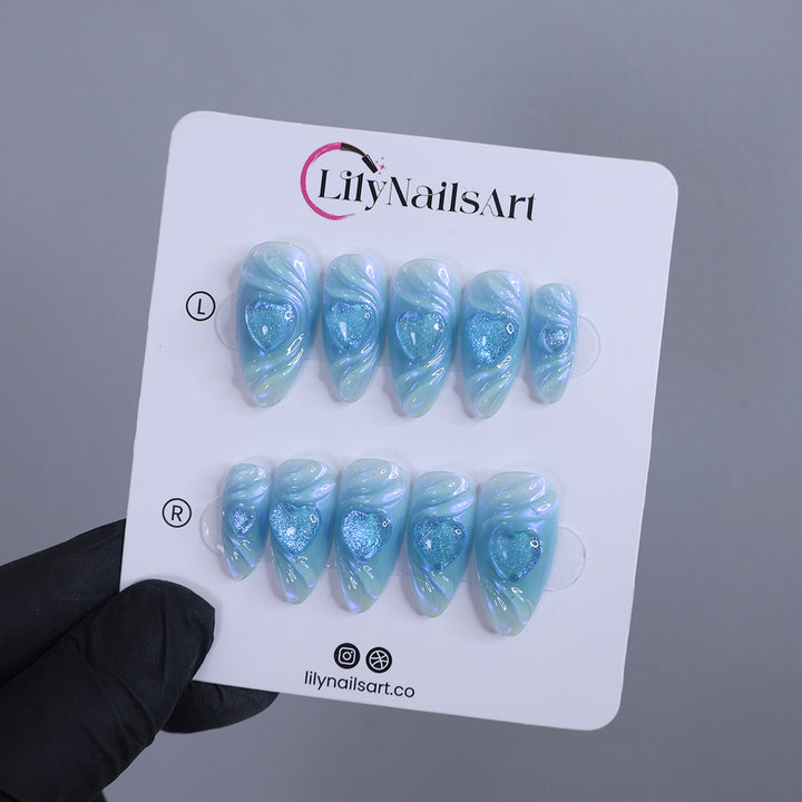 Handmade Blue Heart Press-On Nails – Valetine Collection - soft blue tones with shimmering 3D heart accents. Perfect for birthdays, holidays, anniversaries, or as a thoughtful gift for her.