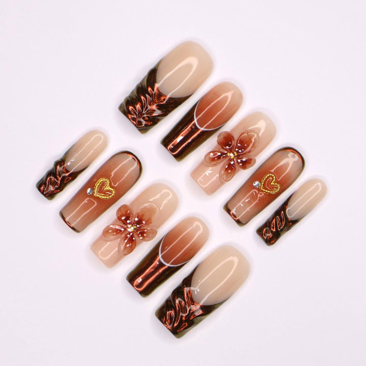 Amber Bloom Handmade Press-On Nails – elegant amber tones with 3D floral accents, shimmering details, and a glossy finish. Perfect for holidays, birthdays, vacations, or as a thoughtful gift for her.